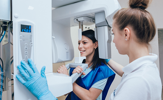 Female patient having teeth scanned