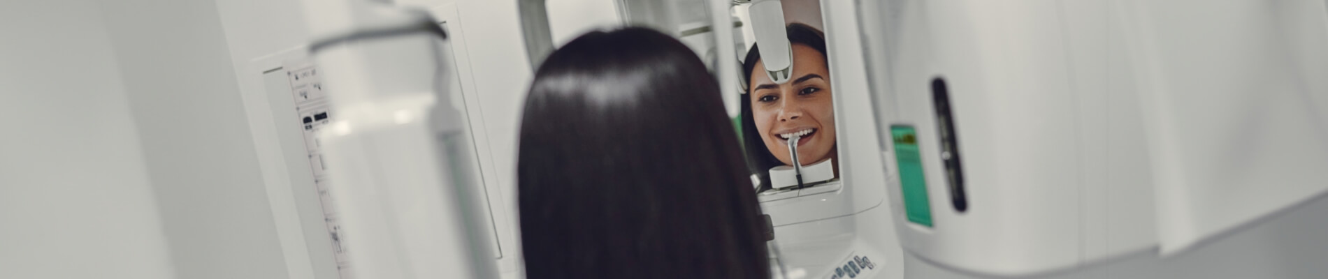 Female patient having dental X-rays taken