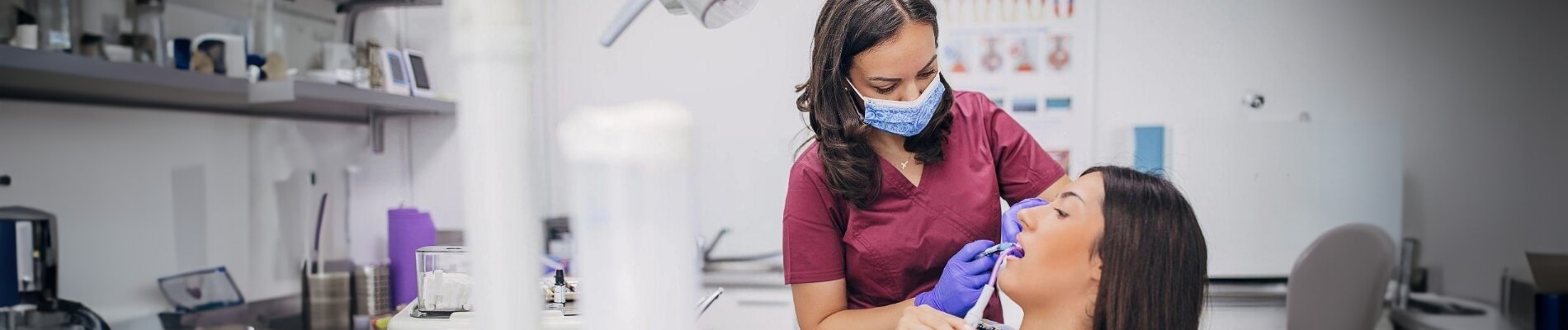 Female dentist giving patient a checkup