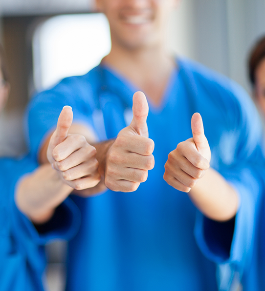 Three Frisco dentists giving a thumbs up