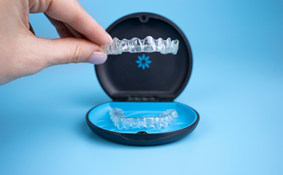 Taking Invisalign aligner out of its case