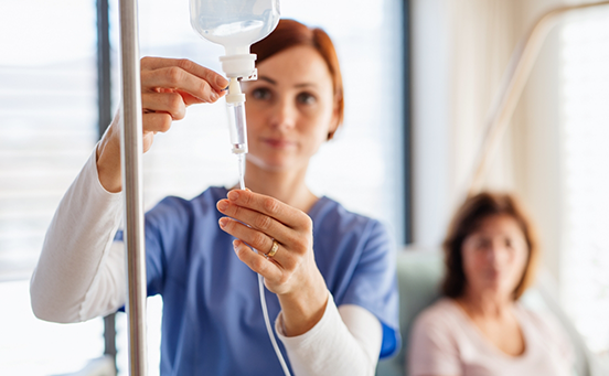 Dentist adjusting drip used for IV sedation